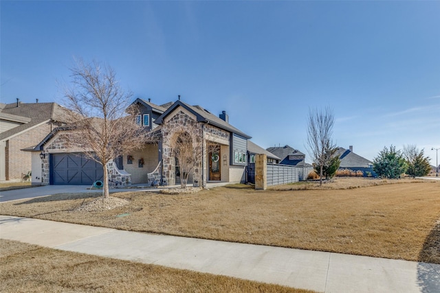 view of front of home with a garage and a front lawn