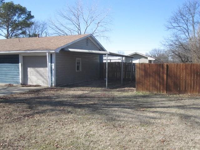 view of property exterior with a garage