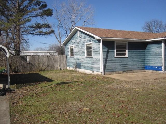 view of property exterior with a yard