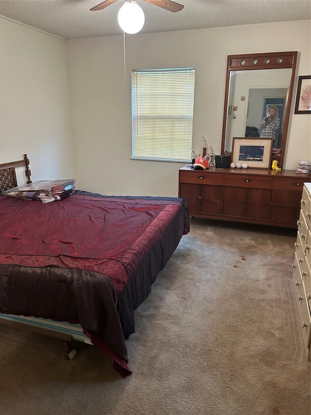 153 County Road 1605, Clifton, TX 76634 - bedroom featuring carpet, ceiling fan, and a textured ceiling