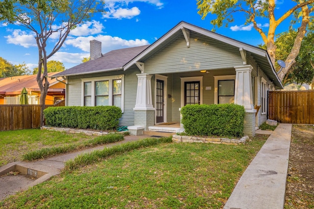 bungalow with a front lawn