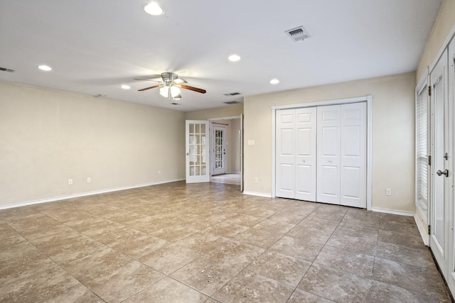 unfurnished bedroom featuring french doors and ceiling fan