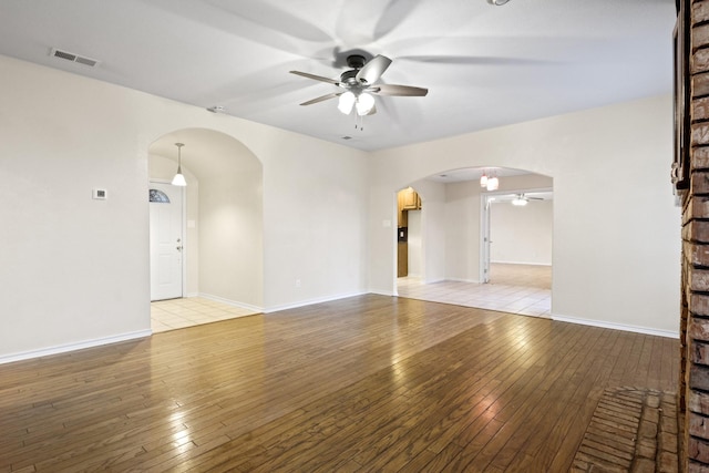 spare room with ceiling fan and light hardwood / wood-style floors