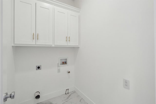 laundry area with cabinets, gas dryer hookup, hookup for a washing machine, and hookup for an electric dryer