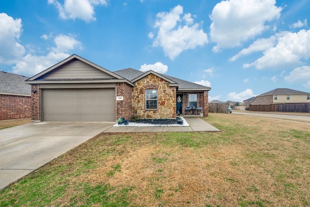 single story home with a garage and a front lawn