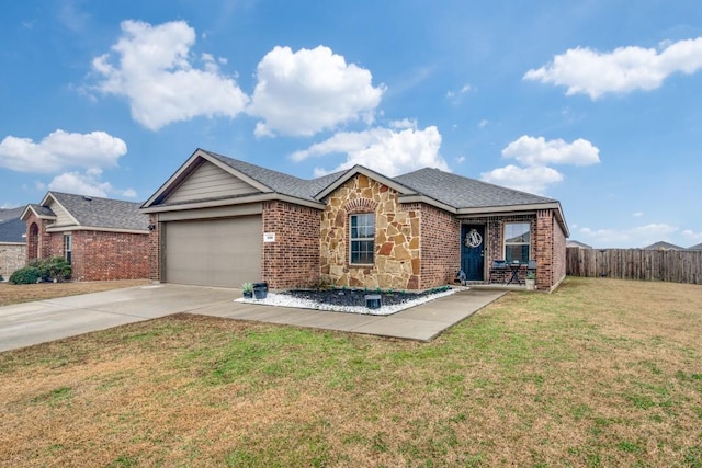 ranch-style home featuring a garage and a front lawn