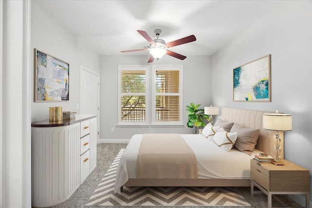 carpeted bedroom featuring ceiling fan