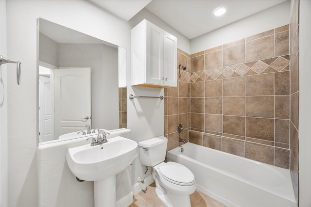 full bathroom with sink, tile patterned floors, toilet, and tiled shower / bath