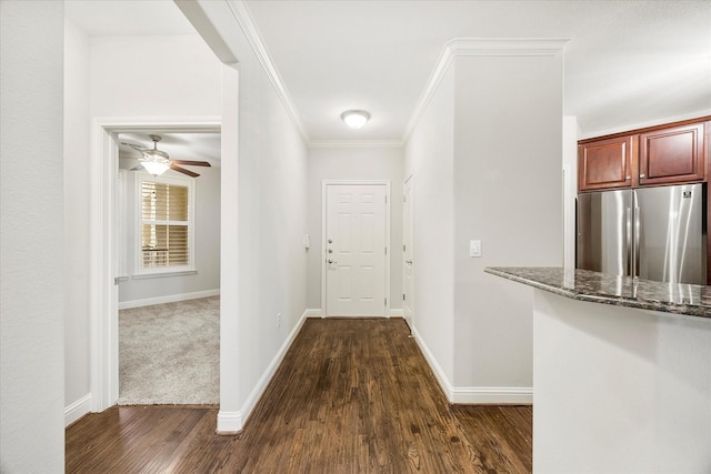 corridor featuring ornamental molding and dark hardwood / wood-style floors