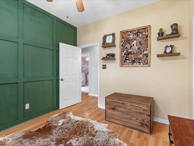 bedroom with light hardwood / wood-style flooring, a closet, and ceiling fan