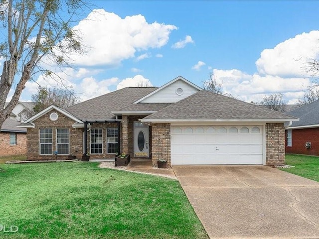 ranch-style home featuring a garage and a front lawn