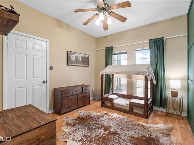 bedroom featuring ceiling fan and light wood-type flooring