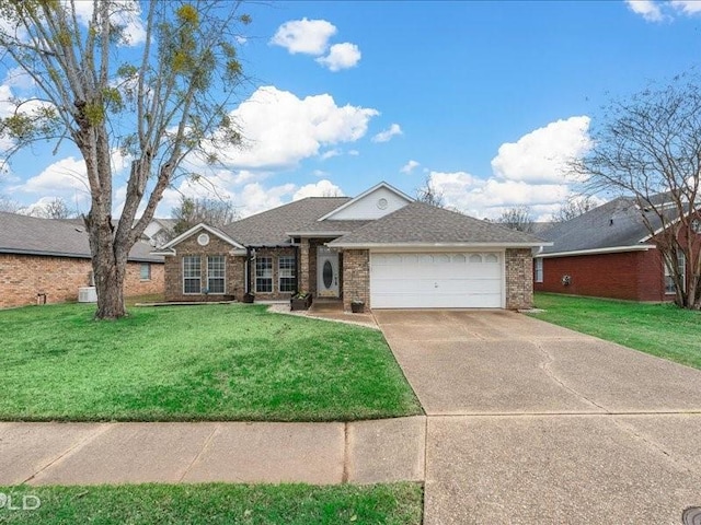 single story home with a garage and a front yard