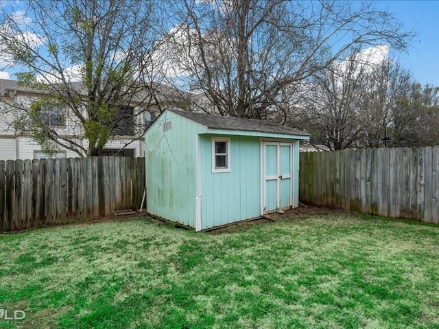 view of outbuilding with a lawn