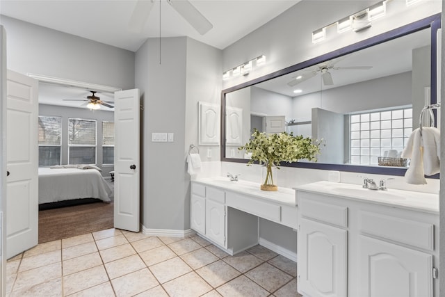 bathroom featuring tile patterned flooring, vanity, and ceiling fan