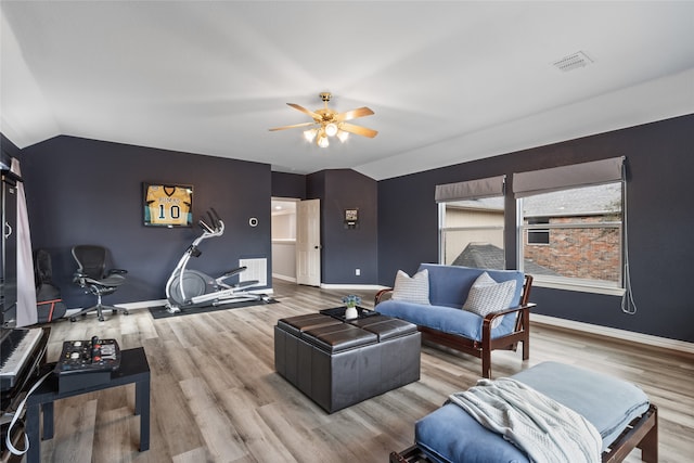 living room featuring vaulted ceiling, hardwood / wood-style floors, and ceiling fan