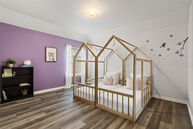 bedroom featuring dark hardwood / wood-style flooring