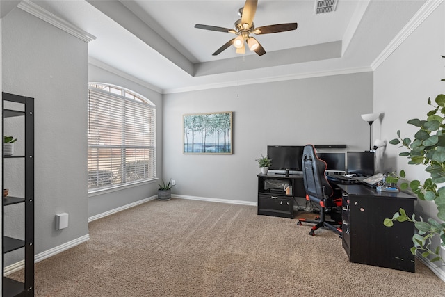 office area featuring ornamental molding, carpet flooring, and a tray ceiling