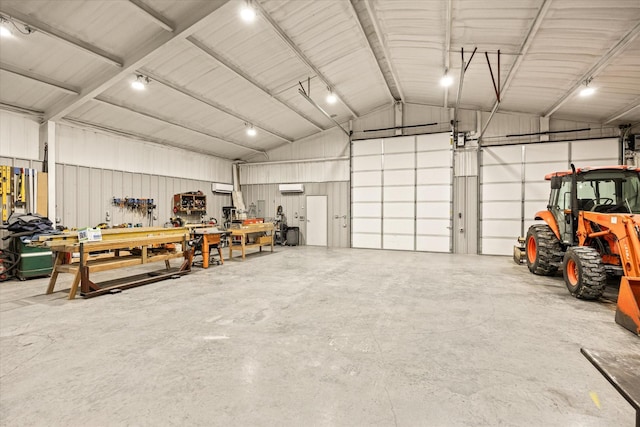 garage featuring a garage door opener and a workshop area