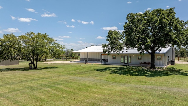 back of house featuring a yard