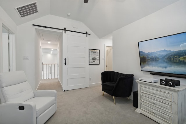 living area with vaulted ceiling and light carpet