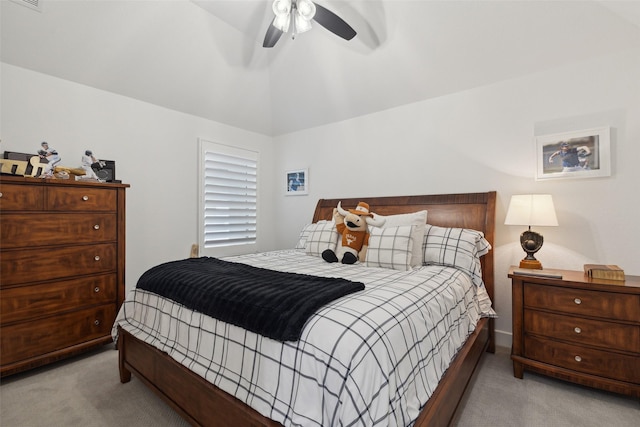 bedroom with light colored carpet, visible vents, a ceiling fan, and vaulted ceiling