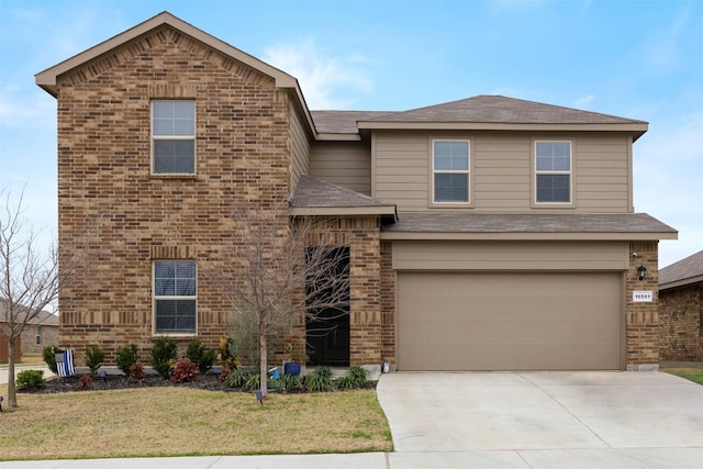 view of front property featuring a front yard and a garage