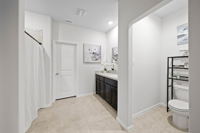 16501 Portage St, Justin, TX 76247 - bathroom with tile patterned floors, toilet, and baseboards