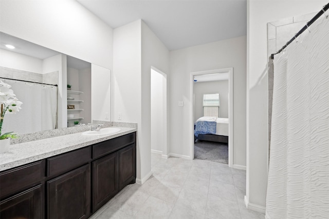 16501 Portage St, Justin, TX 76247 - bathroom featuring baseboards, vanity, tile patterned floors, curtained shower, and ensuite bath
