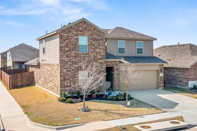 view of front of property with a front yard and a garage