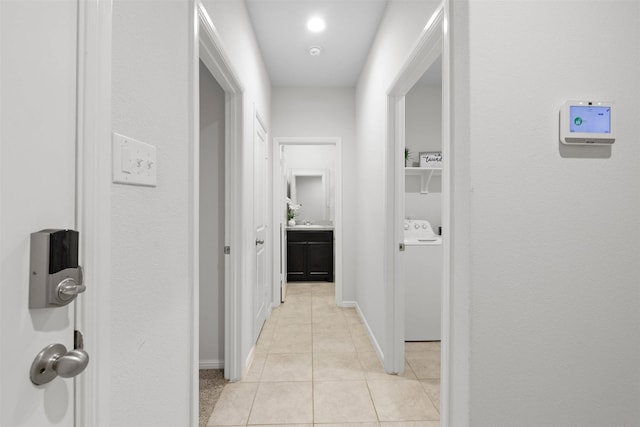 16501 Portage St, Justin, TX 76247 - hall featuring washer / dryer, light tile patterned floors, and baseboards