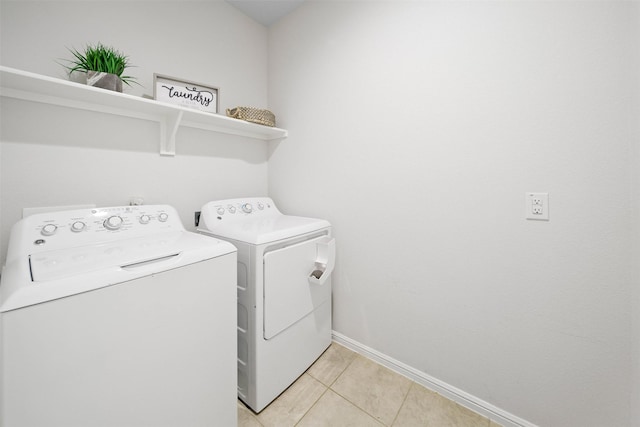 16501 Portage St, Justin, TX 76247 - laundry room with independent washer and dryer, baseboards, and light tile patterned floors