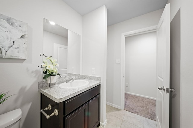 16501 Portage St, Justin, TX 76247 - bathroom featuring vanity, toilet, tile patterned floors, and baseboards