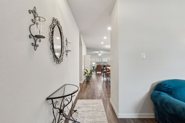 corridor with dark hardwood / wood-style floors