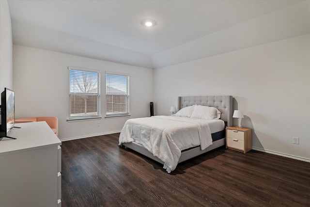 bedroom with dark hardwood / wood-style floors