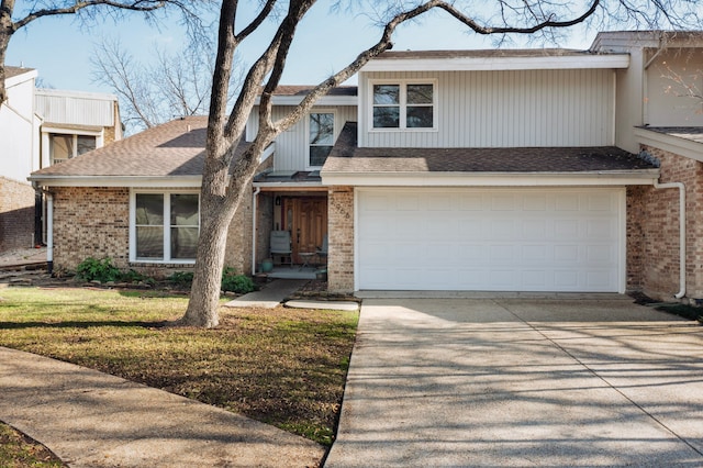 view of front of home with a garage and a front lawn