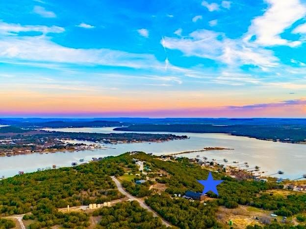 aerial view at dusk with a water view