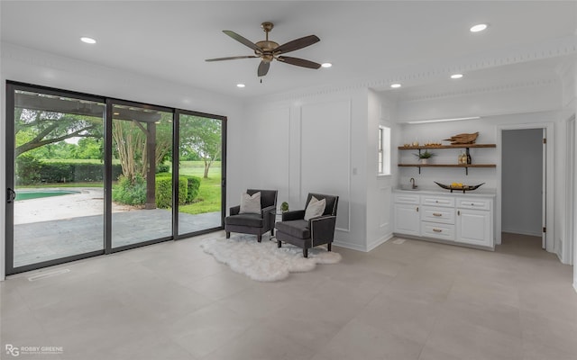 living area featuring ceiling fan