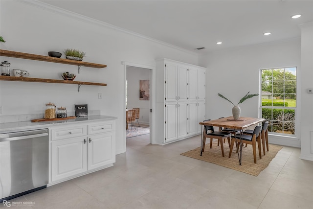 dining space with crown molding