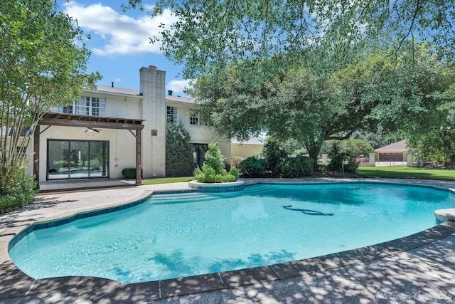 view of pool featuring a patio and ceiling fan