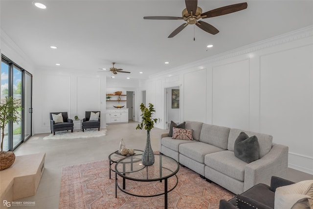 tiled living room featuring ornamental molding and ceiling fan