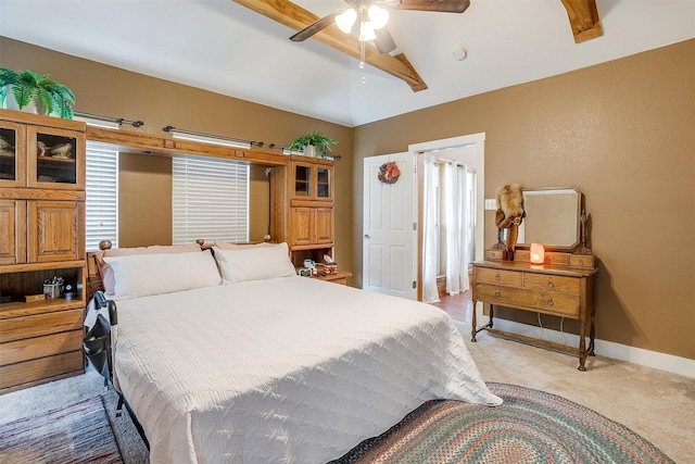 bedroom featuring ceiling fan, light colored carpet, and vaulted ceiling