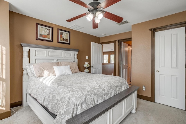 bedroom with light carpet and ceiling fan