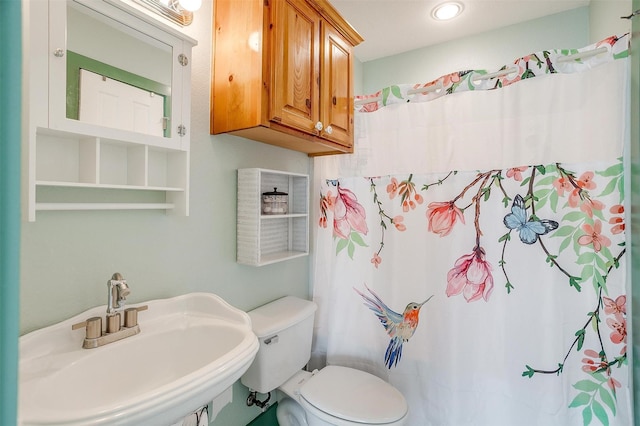 bathroom with sink and toilet