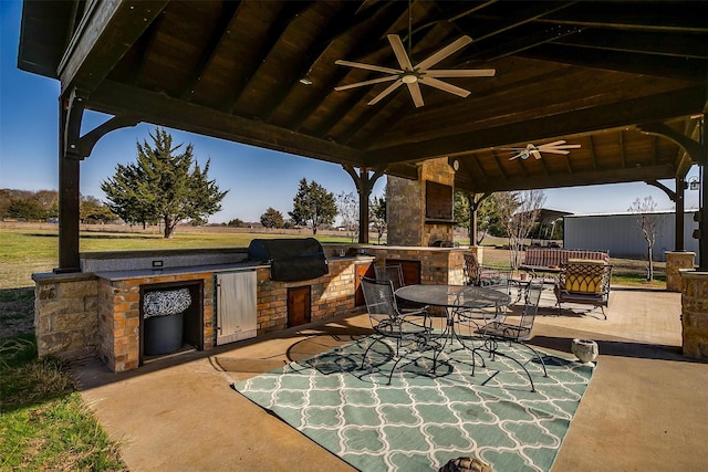 view of patio with area for grilling, a gazebo, and ceiling fan