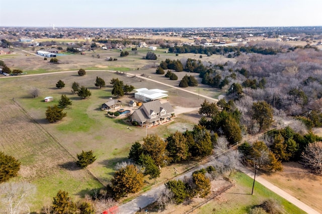 birds eye view of property featuring a rural view