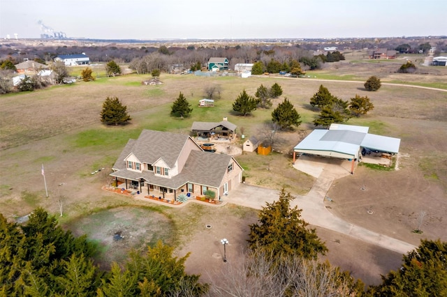 birds eye view of property featuring a rural view