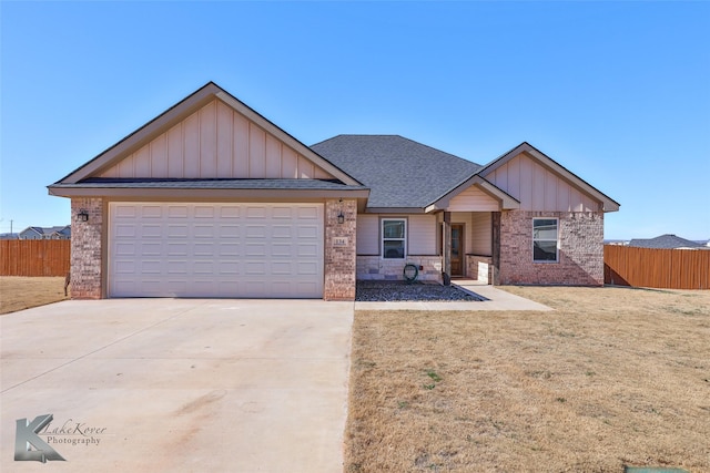 view of front of house with a garage and a front yard