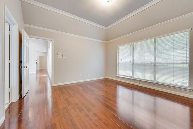 unfurnished room featuring hardwood / wood-style flooring and ornamental molding