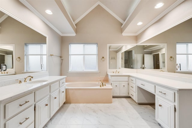 bathroom with crown molding, plenty of natural light, a bathing tub, and vaulted ceiling